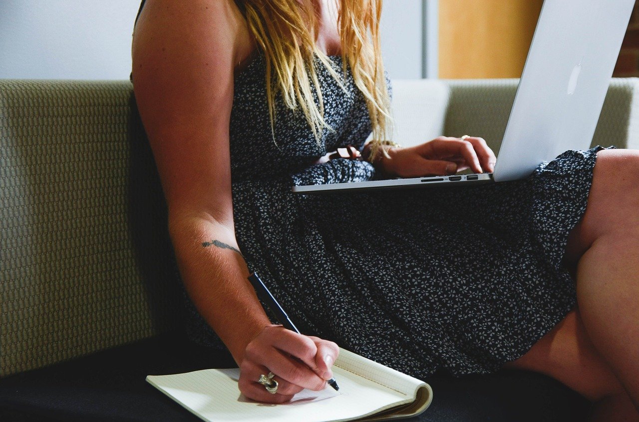 woman laptop taking notes